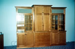 European country style kitchen in Maple with distressed and "rubbed through" painted island and tile inlaid maple hood above.